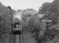 107 027 climbs past the former station at Newburgh with a Perth - Edinburgh service.<br><br>[Bill Roberton //1990]