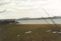 View north at Bowness along the causeway towards the former Solway Viaduct in 2002.<br><br>[Mike Shannon /03/2002]