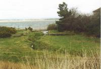 The former canal basin at Port Carlisle viewed from the railway which replaced the canal. The view looks north.<br><br>[Mike Shannon /03/2002]