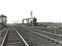 Hurlford class 2P 4-4-0 40597 passing Lochgreen Junction on 28 March 1959 at the head of a Dalmellington - Kilmarnock train. <br><br>[G H Robin collection by courtesy of the Mitchell Library, Glasgow 28/03/1959]