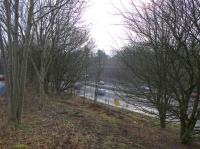 View from the top of the remaining railway embankment at the motor dealer's yard over the M74 and what was the site of Uddingston West station. It seems fairly safe to opine that this station is unlikely to be reopened. Access by kind permission of W Livingston Ltd.<br><br>[Colin McDonald 15/02/2017]