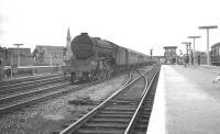 An unidentified V2 2-6-2 about to run north through Doncaster station on the centre road in the summer of 1961. The train is the 10.10am Kings Cross - Glasgow Queen Street<br><br>[K A Gray 29/07/1961]