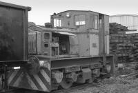 Disused Planet 4wDM with panels of track in the background. 1990<br><br>[Bill Roberton //1990]