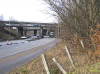 A consignment of goods rolls through Maryville station site. Underneath the M73 flyover in the left centre is the location of sidings and the junction serving the Clydeside coal pit.<br><br>[Colin McDonald 15/02/2017]