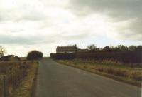 Whitrigg looking west in 2002. The line ran left-right on the far side of the house seen here.<br>
<br><br>[Mike Shannon /03/2002]