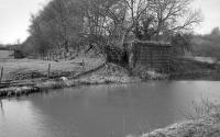 Looking south in 1994 to the abutment of the 1851 bridge over the Union Canal which carried the Slamannan Railway extension to Bo'ness. Off to the right was Causewayend Basin, where coal was transferred from wagon to barge for shipment to Edinburgh. [Ref query 878]<br><br>[Bill Roberton //1994]