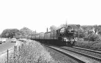 To commemorate the 21st anniversary of the Hull Miniature Railway Society, a return special ran between Hull and Edinburgh on 8 June 1969. The train was hauled throughout by 4472 <I>Flying Scotsman</I>, seen here near St Germains level crossing approaching Edinburgh on the outward leg.<br><br>[Dougie Squance (Courtesy Bruce McCartney) 08/06/1969]