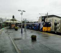 An Inner Circle service calls at Cathcart on 04/03/2017. On the far left 'N' above the signal indicates that the road is set for a Neilston train. 'C' is displayed for circle trains.<br><br>[David Panton 04/03/2017]