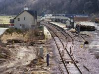 Looking east to Garve Station with evidence of track renewals. The looped goods yard had been altered to only be served from the Dingwall end around the time the road bridge to the west of the station was replaced by a level crossing.<br><br>[Bill Roberton //1988]