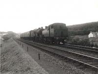 A down train approaching Dalbeattie in the summer of 1956. The train is double headed, with Dumfries shed's Stanier 3P 2-6-2T 40170 piloting Stranraer based Fowler 2P 4-4-0 40623.<br><br>[G H Robin collection by courtesy of the Mitchell Library, Glasgow 14/07/1956]