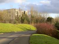 View south to the point where what is now Baillieston Road crossed over the line between the sites of Calderpark Halt and Broomhouse Station. To the right was Broomhouse Colliery, now a housing estate. The flats on the left were recently built partly on the solum, very near the site of Calderpark Halt.<br><br>[Colin McDonald 20/02/2017]