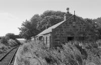 Brucklay looking to Aberdeen in 1977. Following line closure, the derelict station building has since been converted into a house and the road bridge has gone.<br><br>[Bill Roberton //1977]