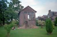 The 'C' listed 1893 Kippen signal box seen in 1987 while still in good condition. Since the photograph the building has greatly deteriorated and taken on a list. The view is from the former Stirling platform, the running lines formerly being to the right of box. This box controlled the station, loop and level crossing. It is currently the subject of a planning application.<br><br>[Ewan Crawford //1987]