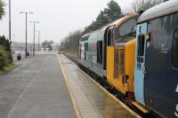 37402 has a clear signal for departure from the bay platform at Barrow-in-Furness with a service to Carlisle on a wet 11th March 2017.<br><br>[Mark Bartlett 11/03/2017]