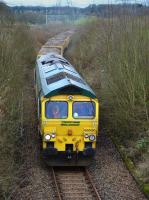 Freightliner 66550 passes Kilbagie with Inverkeithing - Millerhill spent ballast.<br><br>[Bill Roberton 12/03/2017]