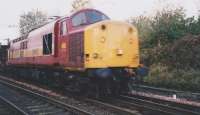 EWS 37797 hauling a coal train probably bound for Cockenzie Power Station from Blindwells enters the crossover from the Down Line.The photo was taken from a position of safety.<br><br>[Charlie Niven /11/1998]