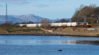 Southbound alumina empties run alongside the Clyde Cardross on 03/03/2017. The Lochaber Smelter has relatively recently (November 2016) transferred from rio Tinto to a new owner GFG Alliance. The new owner has ambitious plans for an alloy wheel plant and car parts manufacturing at the aluminium works site. Perhaps a future source of freight for the railway.<br><br>[Ewan Crawford 03/03/2017]