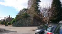 Looking west,  line to Aboyne and Ballater continued behind the bridge abutment.<br>
To the left is Banchory golf club,  in the foreground is a car park beside Bridge Street.<br><br>[Alan Cormack 10/03/2017]