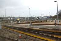 A view of the carriage sidings and Hitachi maintenance facility at Ashford where the Class 395 'Javelin' sets are serviced. In the background is the viaduct that carries the HS1 line bypassing Ashford International station. Photo taken from a 'Javelin' heading to Canterbury West.<br><br>[John McIntyre 03/03/2017]