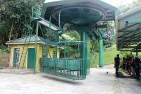 No.1 (of 16) Gondola swings round at the lower station of the St. Lucia Rainforest Experience prior to taking a full load of passengers up the hill side through the forest. The <I>Aerial Tram</I> goes up through the trees at mid-height but returns on top of the forest canopy with outstanding views. Contrary to appearances safety gear is not needed for the ride. This particular group of passengers will be returning by zip wire from the top station. <br><br>[Mark Bartlett 19/02/2017]