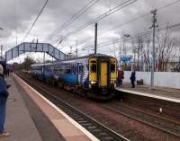 The hourly Shotts line stopping service for Waverley calls at Slateford for on 11/03/2017. It picked up not a bad crowd, perhaps people avoiding the packed buses on a match day at Tynecastle. New CIS screens still under wraps. Slateford is the last station on the line to be equipped, if you ignore Breich. With one train a day, Breich can arguably do without!<br><br>[David Panton 11/03/2017]