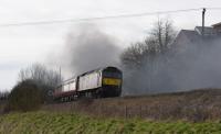 <I>Lord Dowding</I> (aka 34046 <I>Braunton</I>) has just passed by westbound to Bristol on a 'Cathedrals Express', with a WCRC class 47 bringing up the rear of the special, wreathed in smoke.<br><br>[Peter Todd 07/03/2017]