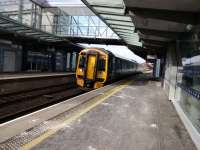 A 158 from Perth calls at Edinburgh Gateway on 14/03/2017. The salt on the platform is a relic of a colder day, but it was blowy here as always. As far as I can see not many people travel into Edinburgh from here as there is no park and ride, and people coming from the airport on the tram would surely stay on it.<br><br>[David Panton 14/03/2017]