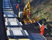 A batch of seven concrete sleeper is set out on the formation of the Down Line at Aberdour.<br><br>[Bill Roberton 19/03/2017]