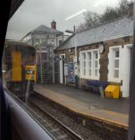 A 'grab shot' of Bromley Cross showing the station building and signal box.<br><br>[John Yellowlees 17/03/2017]