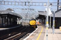 The OLE is progressing well, heading west. Apparently the Electrics come to Didcot at night on trials etc. Not too sure what power they use, diesel or OLE.<br>
<br>
37424 arrived from Oxford and rapidly departed west towards Swindon.<br><br>[Peter Todd 15/03/2017]