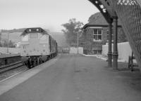 Given the activity around Aberdour signalbox recently I thought this might be of interest. A class 25 passes with a freight in 1977.<br><br>[Bill Roberton //1977]