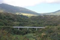 Viaduct over a ghut (valley) on the St Kitts Railway, seen from a train that had crossed it a few moments before. There are many such unfenced structures on the east coast of the island and the train often weaves around a headland then runs up a short valley before crossing one or more of these impressive bridges and heading back to the coast. 