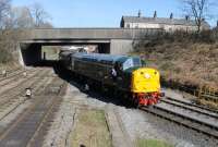 The steam heating boiler of 40106 <I>Atlantic Conveyor</I> was completed and passed its insurance test on 22nd March 2017 allowing the loco to haul (and heat) passenger trains on the ELR on the following weekend. This was the first time in thirty years that it had steam heated a train. There's a tell tale wisp of steam from the front bogie as the shiny EE Type 4 slows to collect the single line staff from the Bury South signalman as it leaves Bolton Street heading for Heywood. Ironically, this was probably the warmest day of 2017 so far. [See image 24898] of the same loco taken in 1982.  <br><br>[Mark Bartlett 25/03/2017]