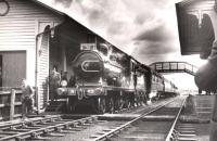 Ex-GNSR 4-4-0 no 49 <I>Gordon Highlander</I> stands with the 1960 SLS/RCTS joint tour at Turriff on 13 June 1960. Photographed looking south from a point alongside the level crossing.<br><br>[RB Parr, courtesy Stephenson Locomotive Society 13/06/1960]