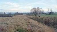 The former junction for the Charlesfield Munitions Factory looking east in 1999. I was standing on the Kelso branch with the Charlesfield siding off to the right. This view is not possible today as the newly planted sapling trees (back then) are now an impenetrable thorny barrier.<br><br>[Ewan Crawford //1999]