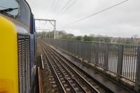 On 20th March the sound from 37419 would certainly draw the attention of any onlookers as it crosses Carlisle Bridge accelerating away from Lancaster with a train for Barrow-in-Furness.<br><br>[Malcolm Chattwood 20/03/2017]