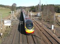 Having completed the descent of Beattock bank, the 0840 Glasgow Central - London Euston is about to run through the site of Beattock station, located just behind the camera, on 27 March 2017.<br><br>[John Furnevel 27/03/2017]