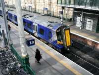 ScotRail 380002 stands alongside platform 19 at Edinburgh Waverley on 24 March 2017.<br><br>[John Furnevel 24/03/2017]