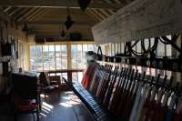 Interior of Bury South signal box taken during a supervised visit on 25th March 2017 with kind permission of the ELR. This view looks south along the old electric line towards Buckley Wells sheds. The operational Heywood line runs behind. After closure in 1980 this box became little more than a shell and everything in this picture is new, including the 65 lever frame. The few white levers illustrate that the vast majority in the frame are operational and the whole box is a credit to the Signalling Department of the East Lancashire Railway.  <br><br>[Mark Bartlett 25/03/2017]