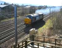 DRS 37259 leaves a smokescreen over the down loop at Beattock on 27 March 2017 as it restarts its journey north, following an interruption to permit the passage of a Glasgow bound Pendolino.<br><br>[John Furnevel 27/03/2017]