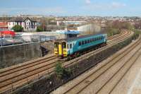 153 320 descends from Swansea Loop West with a Pembroke Dock to Swansea train. Landore depot is directly above the train behind the ATS garage.<br><br>[Alastair McLellan 24/03/2017]