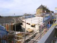 View in March 2017 over the parapet of the temporary pedestrian and services bridge at Station Road. Thhe bridge deck is now in place and the provision for services is evident. <br><br>[Colin McDonald 24/03/2017]