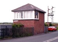 The signal box at Winning Junction, located to the south of Ashington on the Blyth and Tyne route, seen looking north east from the roadside on 25 May 2004. Unfortunately the box name board appears to have been nicked. [See image 46995]<br><br>[John Furnevel 25/05/2004]