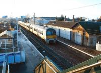 ScotRail 322485 arrives at Prestonpans on 29 January 2003 with an Edinburgh - North Berwick service.  The excavation and construction activity in the left background is in connection with the Dolphingstone deviation of the ECML. This major engineering project became necessary in order to avoid areas of actual and potential subsidence resulting from old mine workings in the area. [See image 44817]<br><br>[John Furnevel 29/01/2003]