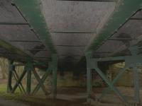 View under the Blantyre Mill Road overbridge just south of Bothwell station. Tke tracks for the goods station ran alongside the platform lines on the other side of the support.<br><br>[Colin McDonald 15/03/2017]