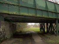 View south under the Blantyre Mill Road bridge and along the Bothwell Nature Trail which follows the trackbed of the former line to Hamilton. The bridge spanned the tracks for the goods station as well as the passenger station, sited behind the camera. <br><br>[Colin McDonald 15/03/2017]