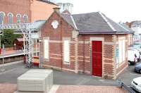 Part of the refurbished 1888 station building at Coatbridge Sunnyside looking east from Gatsherrie Road in May 2005. The Lamberton Engineering building stands in the left background.<br><br>[John Furnevel 02/05/2005]