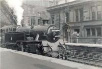 BR Standard class 4 tank 80006 simmering alongside the platform at a sunny St Enoch on 26 July 1953. The locomotive had arrived at Polmadie new from Derby Works 8 months earlier.   <br><br>[G H Robin collection by courtesy of the Mitchell Library, Glasgow 26/07/1953]