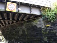 <I>Gartocher Road (Disused)</I> states the small yellow sign on the right. Not so, as anyone who tries to stand in the middle of the road to photograph the bridge will quickly discover. The bridge, however <I>is</I> disused.<br><br>[Colin McDonald 20/03/2017]