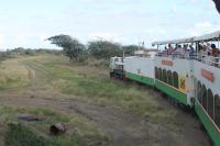 The northbound St Kitts Scenic Railway train passes an abandoned sugar cane transfer station, one of many on the surviving eighteen miles of line. Some remaining tracks can be seen in the immediate foreground but most of the sidings have been lifted since cane traffic ceased in 2005. <br><br>[Mark Bartlett 18/02/2017]